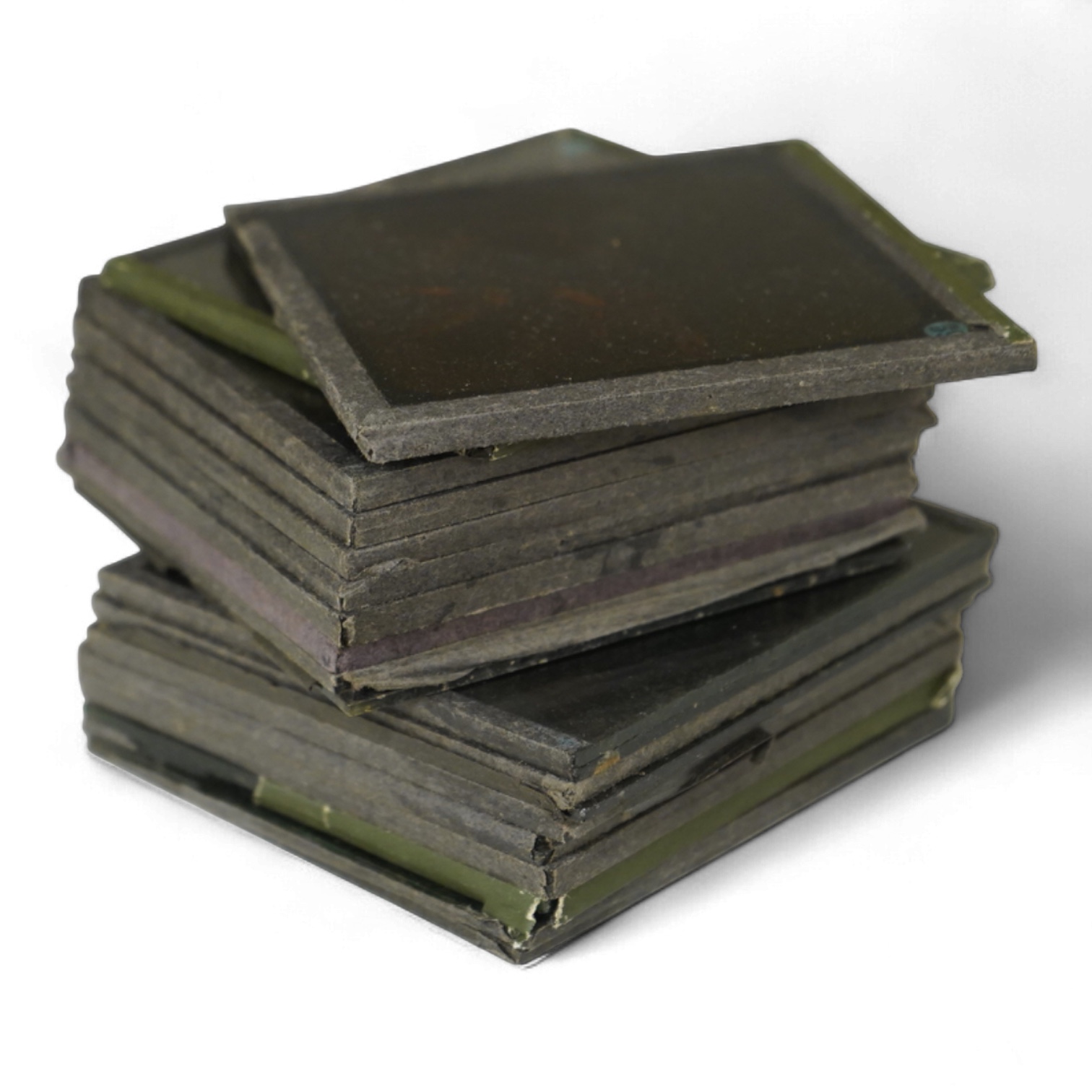 A group of sixteen Zulu War related magic lantern slides, plus some related contemporary newspaper cuttings pasted onto board referring to Rorke’s Drift